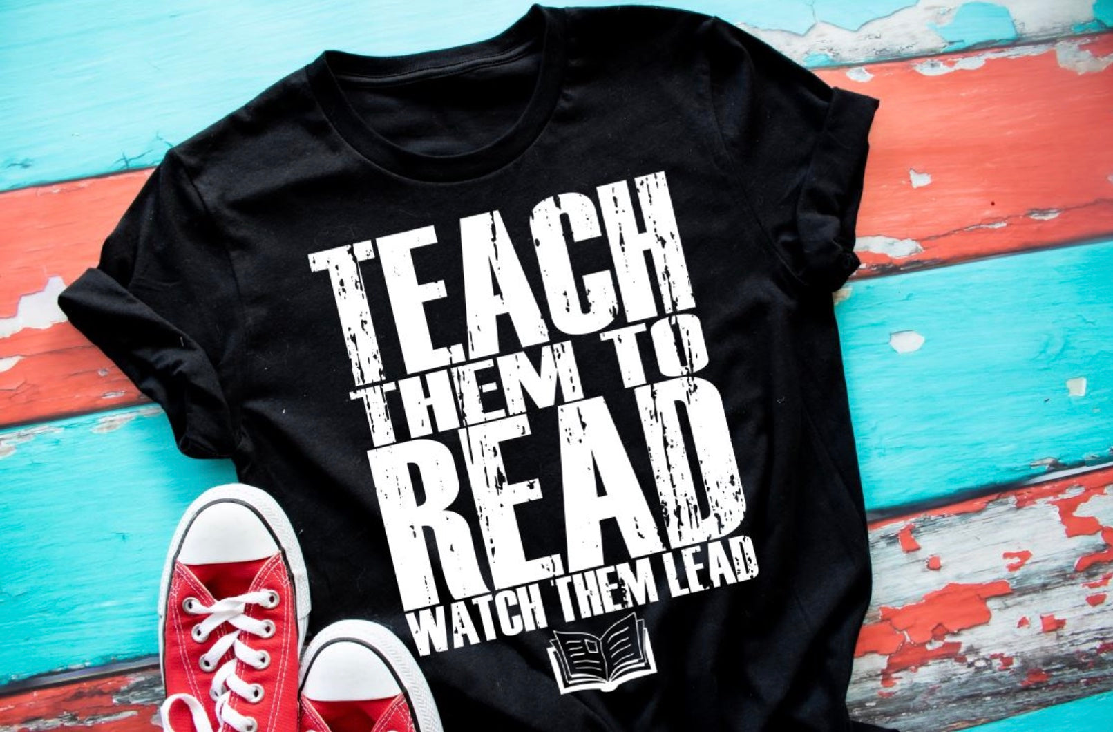 Teach them to read watch them lead unisex tee