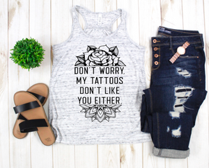 Don't worry my Tattoos don't like you either women's flowy racerback tank