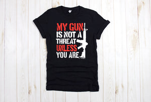 My gun is not a threat unless you are unisex tee